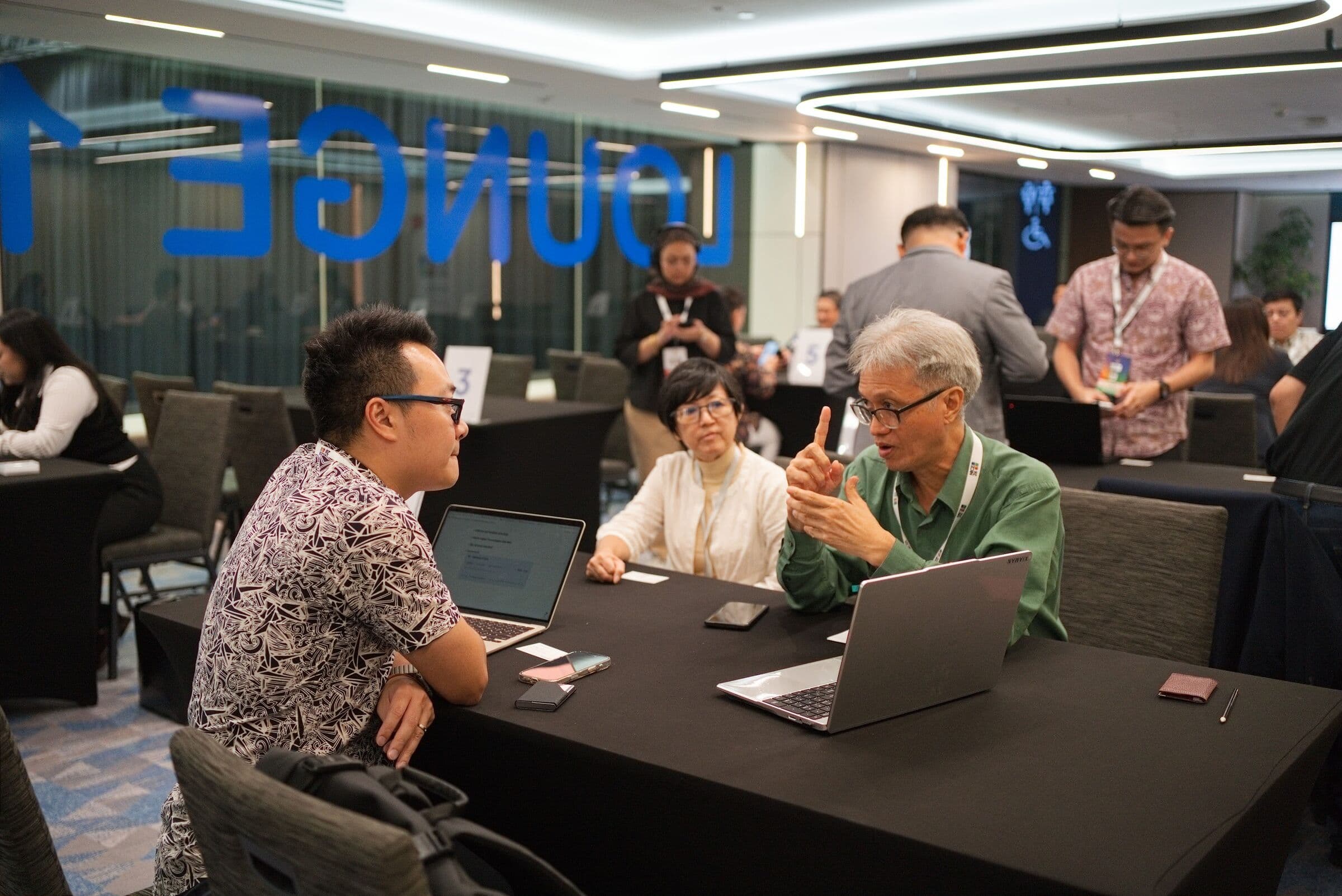 A founder and two fund representatives in a 1:1 meeting, NICE 2026